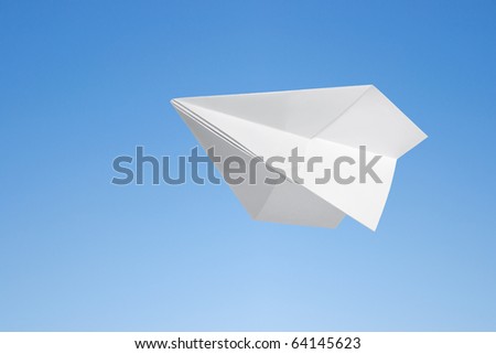 Paper airplane against the blue sky