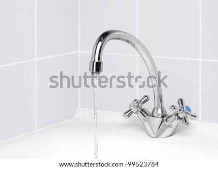 water tap from which the water pours