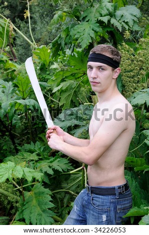 Being cut through through thickets hogweeds Siberian. Young men portrait
