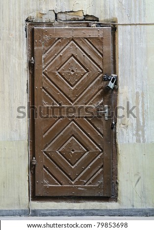 The door closed on lock in a church vault.  Ancient building