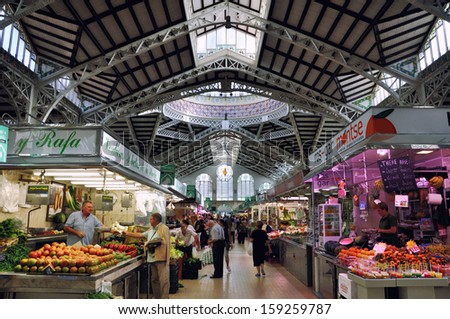 VALENCIA, SPAIN - OCTOBER 15: View of crowded Central Market on October 15, 2013 in Valencia, Spain. It is considered one of the oldest European markets still running, most vendors sell food items.