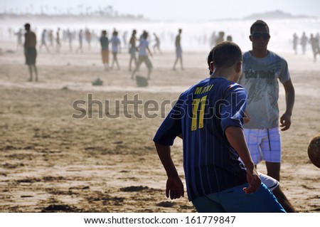 CASABLANCA, MOROCCO - AUGUST 28: Locals playing football at the beach on August 28, 2011 in Casablanca, Morocco.