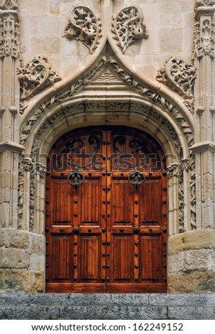 Beautiful wooden Door of old Cathedral in Sitges, Costa Dorada, Spain
