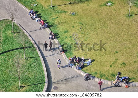 GHENT, BELGIUM - MARCH 6, 2014: Aerial view of the people spending time outside in the famous Flemish city which hosts many students and tourists.
