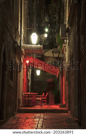 Night view of streets of old city Dubrovnik, Croatia with cafe