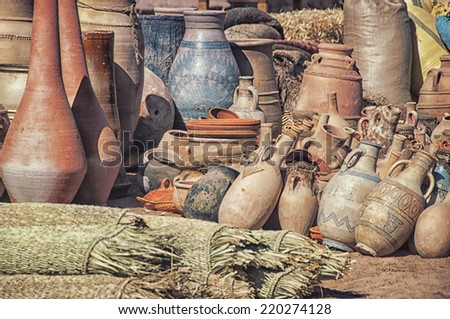 Differently sized dusty Clay pots stuck together at the village market in Moroccan town Ouarzazate