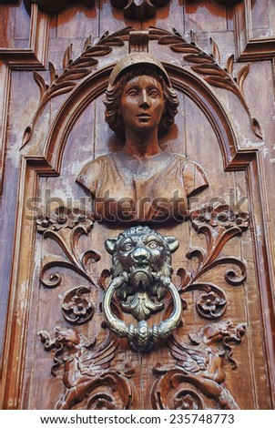 Wooden sculpture at the doors of some building in Puebla de Zaragoza, Mexico