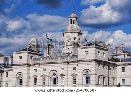 Close view of Horse Guards building in London, UK with silver clouds at the background