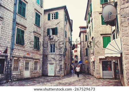 KOTOR, MONTENEGRO - JULY 3, 2009: Streets of famous old town and resort. It\'s a coastal town located in the Gulf of Kotor, old fort is part of the World Heritage Site