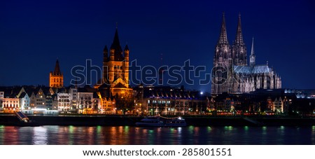 Cologne, Germany. Panoramic view of city center with Cathedral, Great St. Martin Church and other historical buildings, various restaurants, cafes and bars