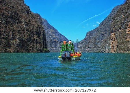 Canyon del Sumidero in Mexico - popular place for Boat Trips. A boat sailing in canyon waters.