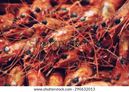 Blurred food background. Display of fresh prawns in a fish market in France