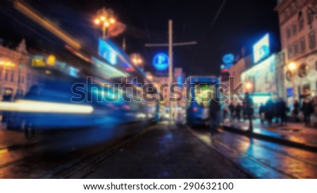 Blurred travel backgrounds. Famous blue Tram in the center of Zagreb, Croatia with local people at night. First electric tram ran in 1910