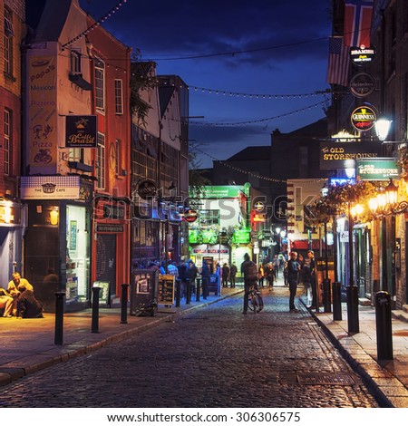 DUBLIN, IRELAND - SEPTEMBER 7, 2014: Nightlife at popular historical part of the city - Temple Bar quarter. The area is the location of many bars, pubs and restaurants