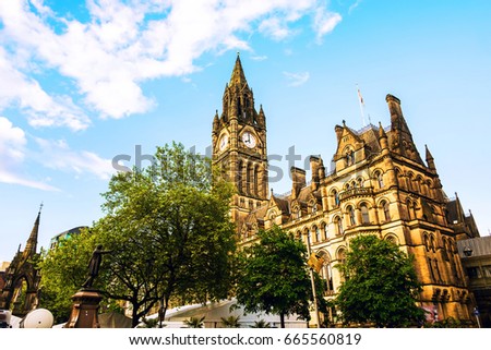 Manchester, UK. Town Hall of Manchester, UK with cloudy sky during the sunny day