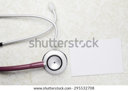 medical concept Stethoscope and paper note on table background