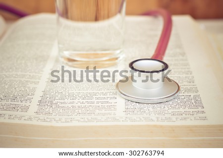 top view of Stethoscope on a book / vintage color