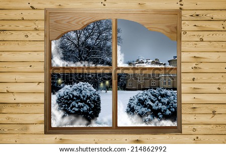 Christmas design. Winter christmas concept - a beautiful view of winter from the wooden window in wooden wall.