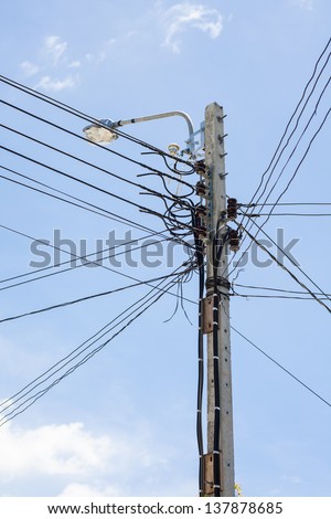 low voltage electricity post and cable in sunny day
