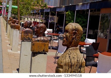 JOHANNESBURG - MARCH 01: Wooden heads on stand on plinths in Newtown on March 01, 2013. The artists intended these heads to reflect the faces African diversity.