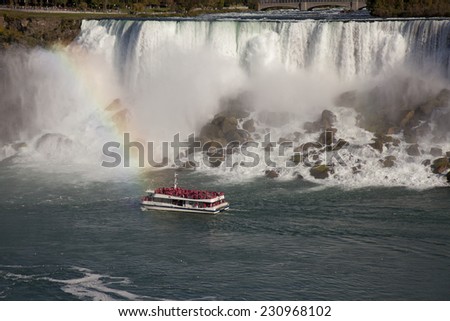 NIAGARA FALLS - OCTOBER 12, 2014: The famous Falls boat tour experience is North America\'s oldest attraction, and has drawn millions of visitors since 1846.