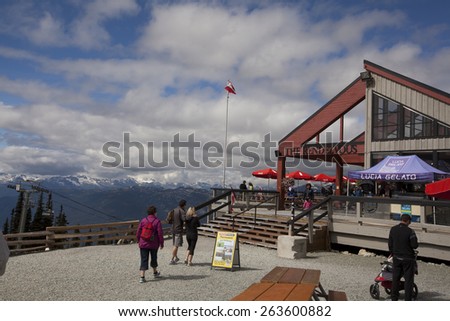WHISTLER, BRITISH COLUMBIA - SEPTEMBER 2, 2012: Tourists take a break at a restaurant at the top of Whistler mountain. Whistler and Blackcomb mountains draw millions of tourists eah year.