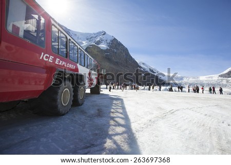 ALBERTA, CANADA - SEPTEMBER 8,2012:  Ice Explorers, designed for glacial travel, take tourists onto the surface of the Athabasca Glacier on September 8,2012  in the Columbia Icefields, Canada.