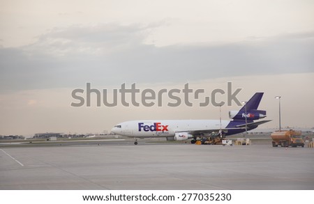 TORONTO - APRIL 30, 2015: FedEx Express is a subsidiary of FedEx Corporation, delivering packages and freight to more than 375 destinations in nearly every country each day.