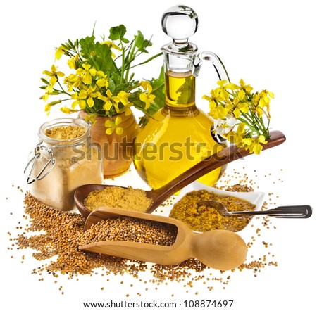Mustard oil jar and mustard powder spoon, seeds scoop, with fresh mustard flower on white