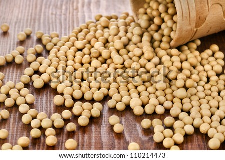 Soy beans in a basket on wooden desk