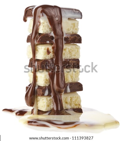 tower stack of chocolate pieces with creamy syrup poured on white background