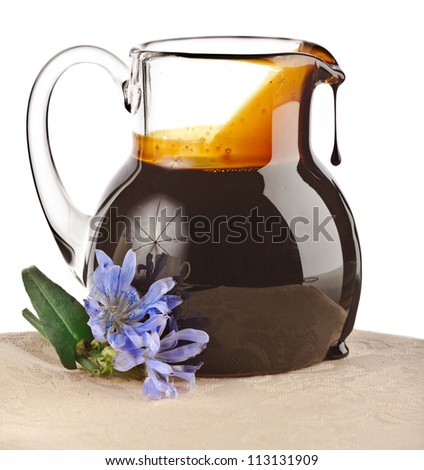 healthy diet chicory drink in a glass pitcher ( coffee substitutes )  isolated on white