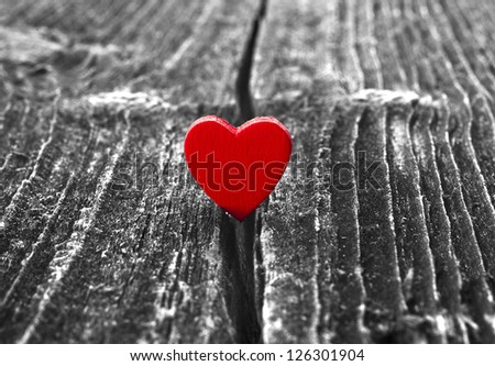 symbol of love is in trouble, the crack of rustic wood texture, valentines day card concept