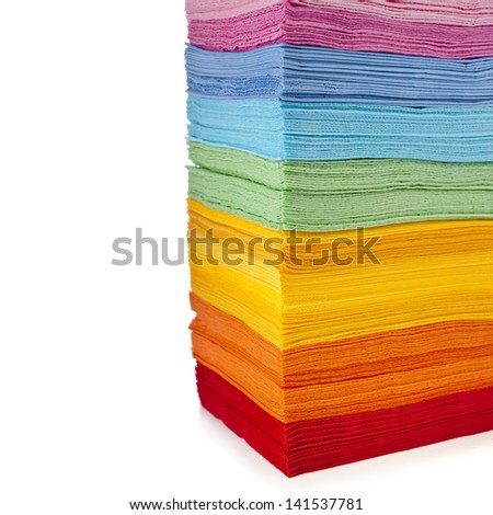 Border of tower serving colored paper napkins isolated on white background
