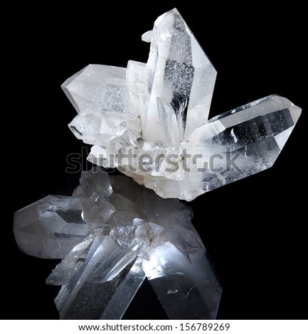 Lovely terminated white rock crystal with reflection against black background