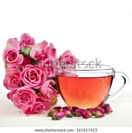 Tea cup with rose bouquet isolated on white