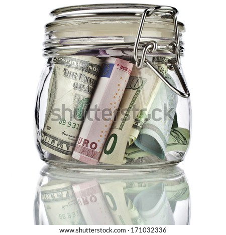 Money Banknotes Jar Full Of Savings Isolated On White Background. Business Concept.