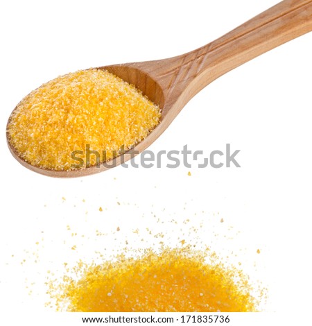 cornmeal maize flour heap in wooden spoon isolated on white background