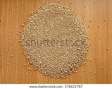 Dry yeast balls in wooden board table surface top view