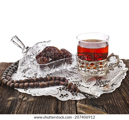 Ramadan festival eastern  drink with dates in wooden table isolated on white background