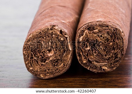 Two Cuban Cigars close up macro  in the Box in mahogany wood