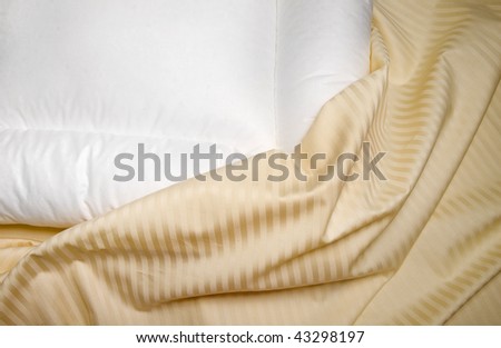 white orthopedic pillow with  beige  sheets