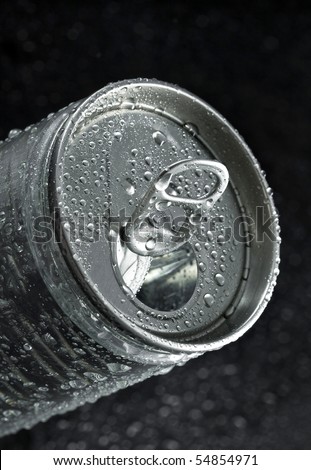 drink can with water droplets on black background