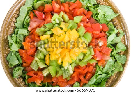 clay bowl of vegetable salad surface top view close up isolated on white