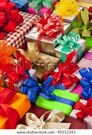 many colorful gift boxes with ribbon bows