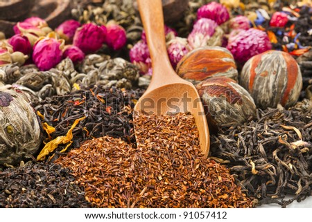 different tea types : green, black, floral , herbal  rooibos  with bamboo spoon