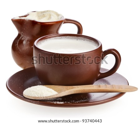 powder milk in  clay  pitcher and cup on white background