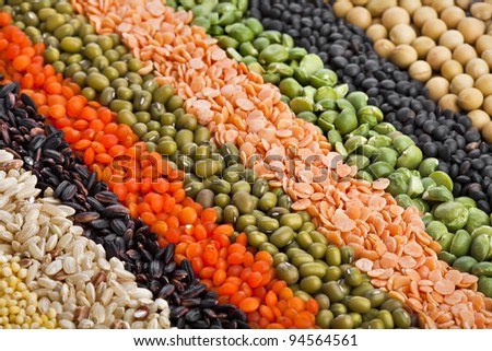 colorful  striped rows of dry lentils, soya beans,  grain ,peas, groats , buckwheat, soybeans, legumes, rice, backdrop