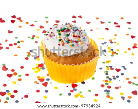 cupcake with colorful sprinkles on white background