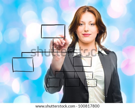 Business woman designing a plan on screen  with blue lights in the background